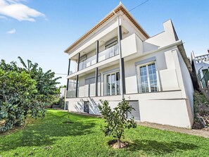 A two-story residential building with a flat roof, large windows, and a well-maintained lawn. - Florentina by Interhome (Gaula)