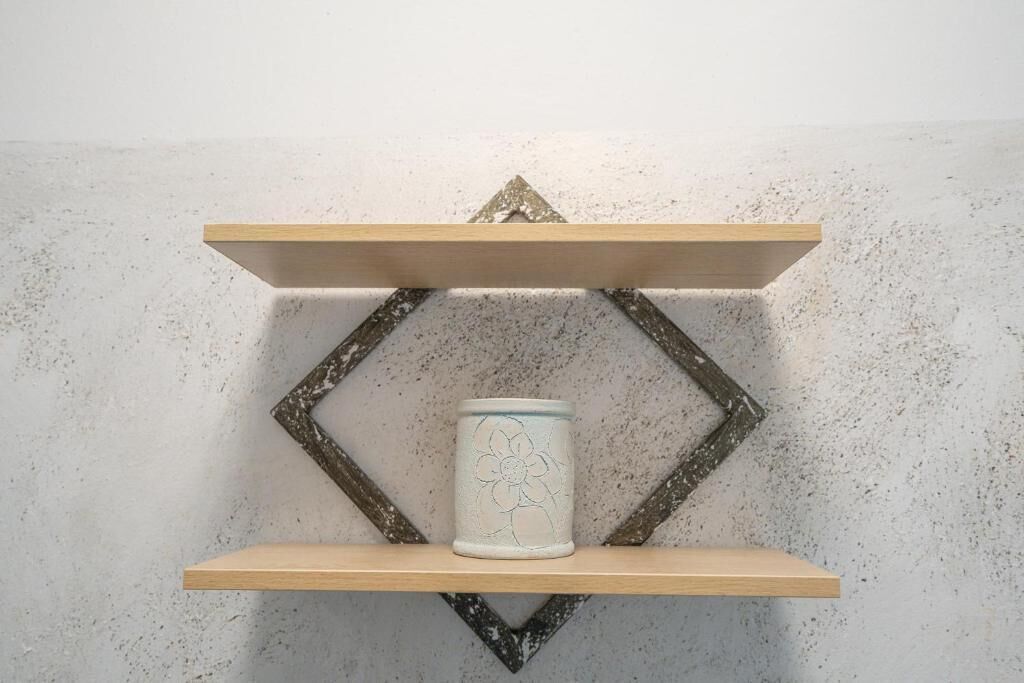 A shelf with a decorative item.