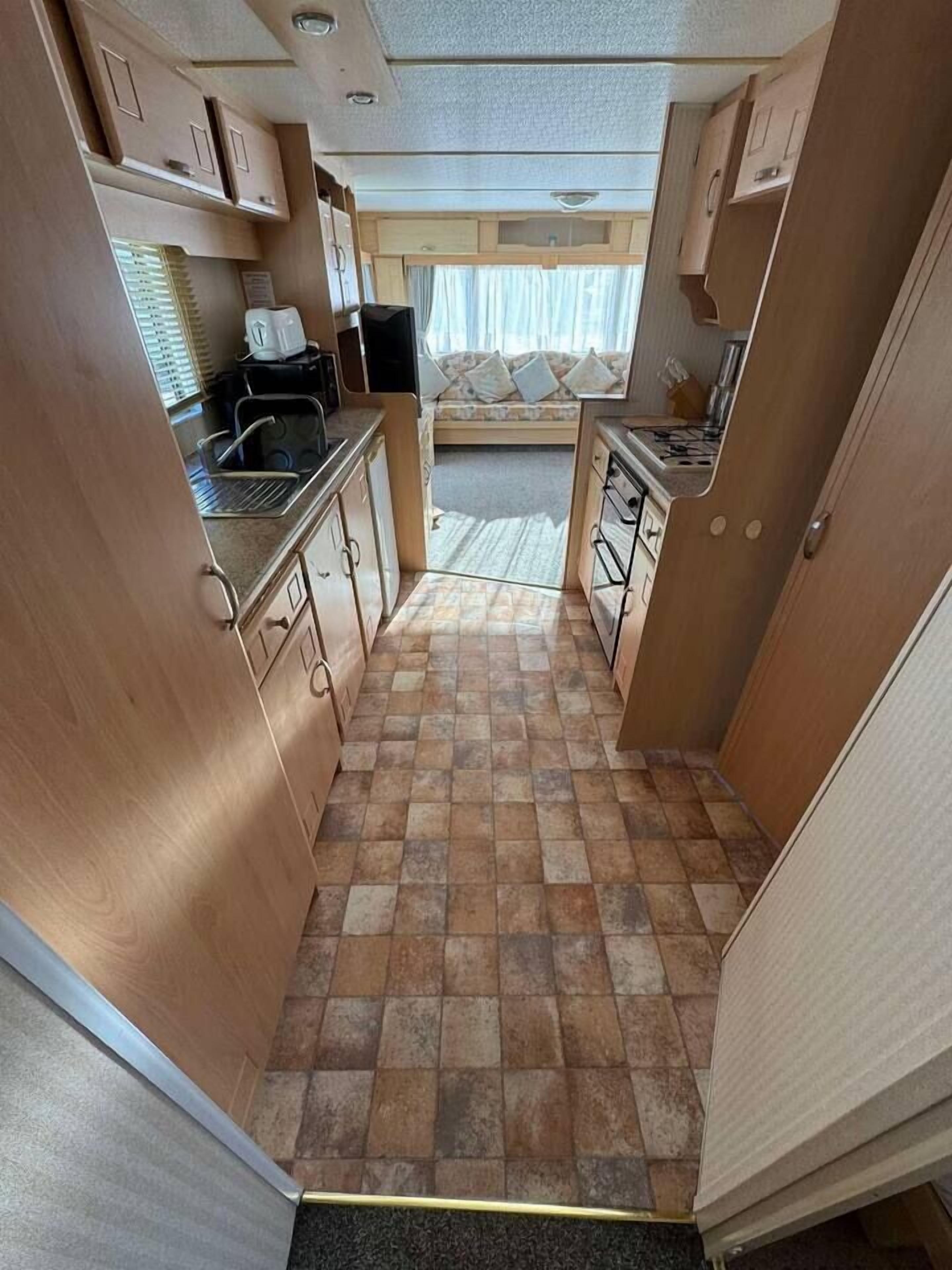 Fridge, microwave, electric kettle, cookware/dishes/utensils