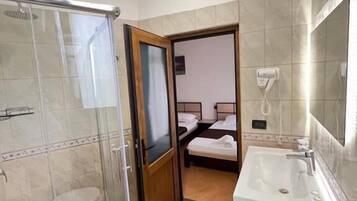 Standard Triple Room, Balcony, Lagoon View | Bathroom | Shower, hair dryer, towels, soap