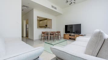 Family House | Living area | 65-inch Smart TV with digital channels, Netflix, streaming services