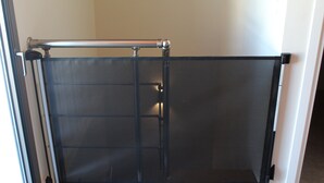 A room with a sliding glass door, a metal railing, and a tiled floor. - Zidros Apartments Maisonette Apartment 4 (Sfakaki)