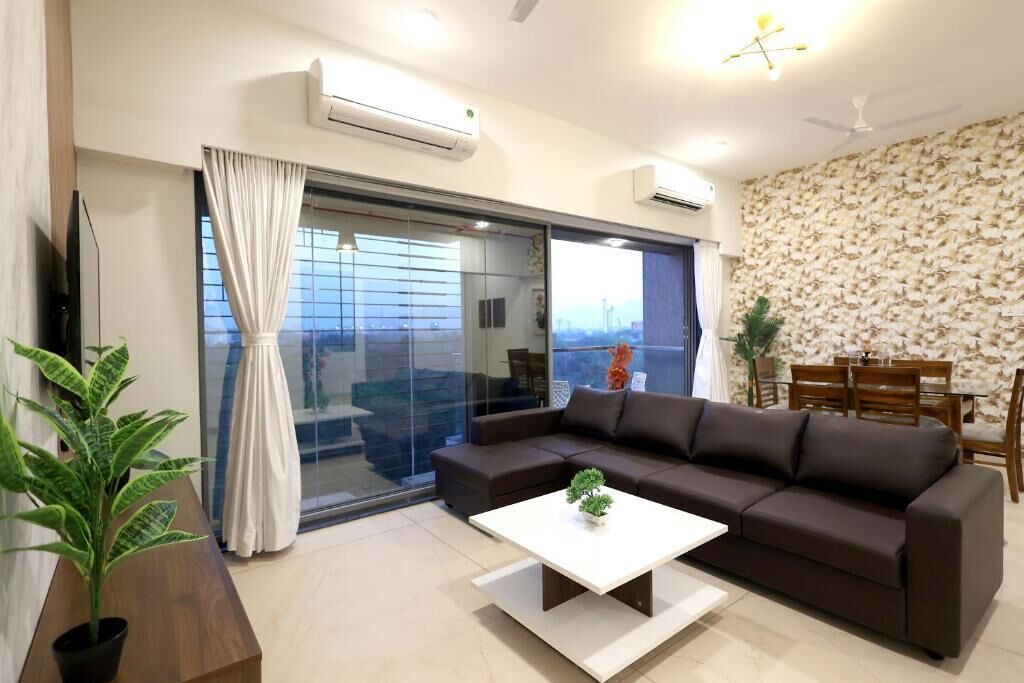 Apartamento, balcón, vistas a la ciudad | Zona de estar