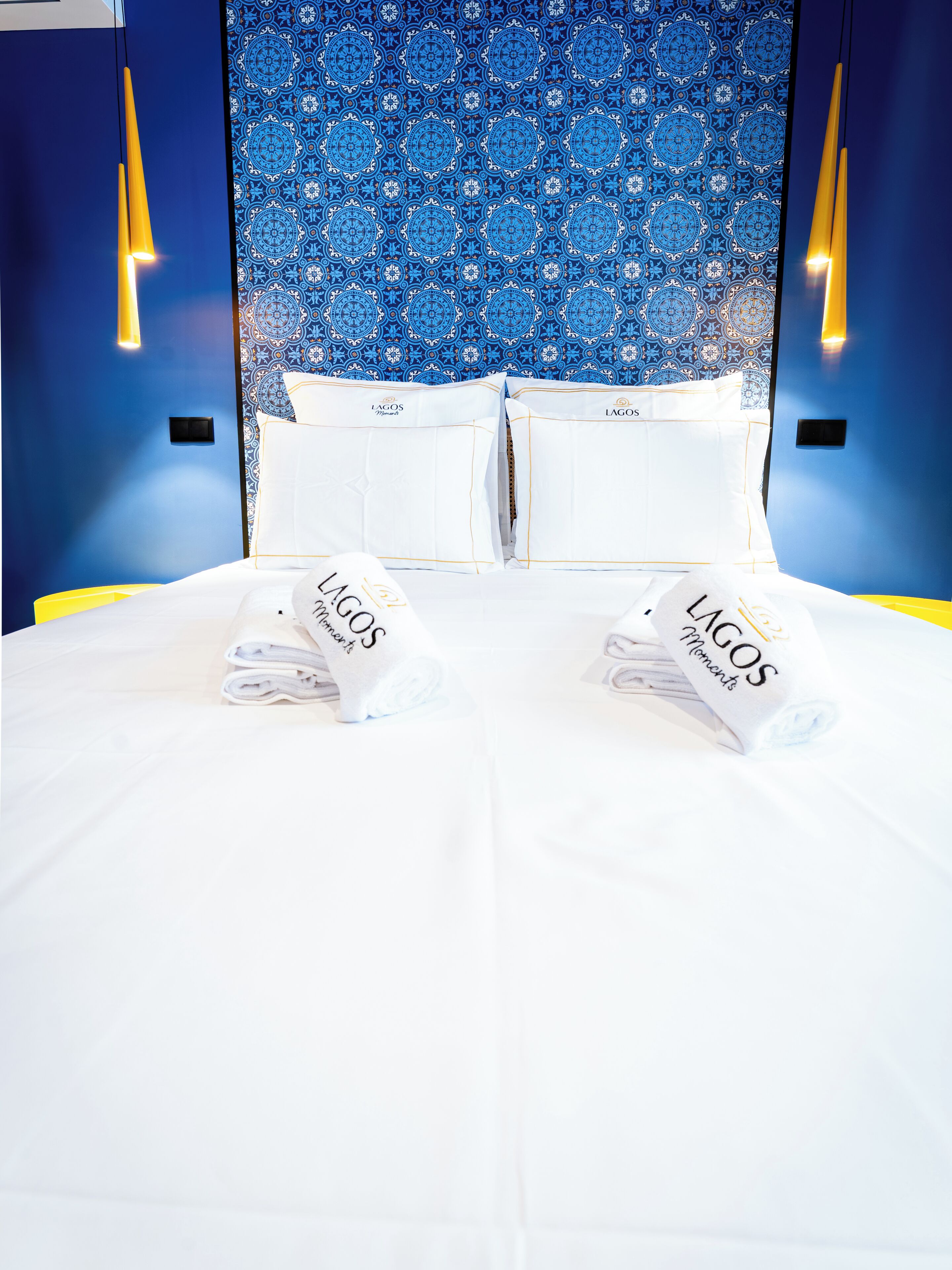 Premium bedding, pillow-top beds, desk, laptop workspace
