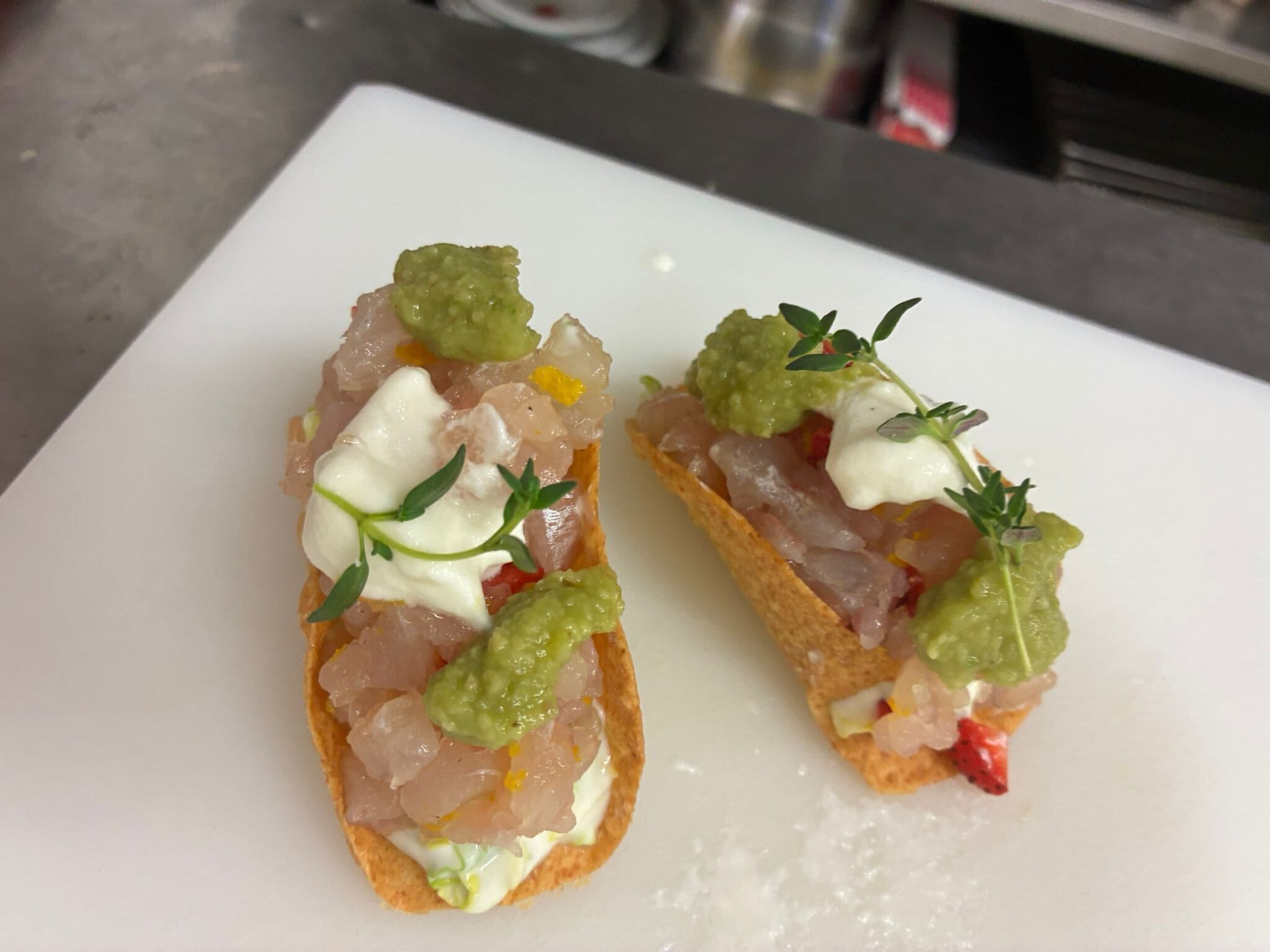 Two appetizers on a white plate.