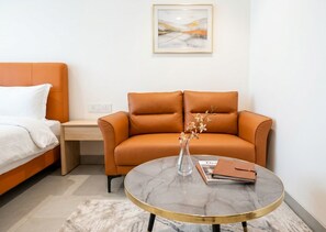 Twin Room, Balcony | Living area | 32-inch Smart TV with satellite channels - Hotel Ritora (Bengaluru)