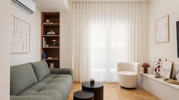 Departamento Deluxe | Área de sala de estar | Smart TV de 55 pulgadas con canales vía satélite