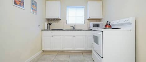 Fridge, microwave, stovetop, cookware/dishes/utensils