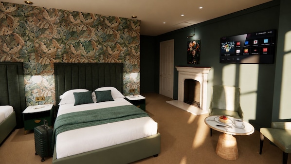 A hotel room with a bed, a nightstand, a table with a cup and a plate, a fireplace, and a wall-mounted TV. - The Villa (Montrose)