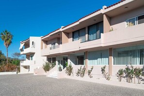 A multi-story building with a flat roof and a balcony on the upper floor. - Golden Sun Adults-Only Luxury Apartment in Rhodes (Rhodes)