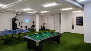 A recreational room with a pool table, ping pong table, and exercise equipment. - Crethion | Private Pool, Jacuzzi, Gym & Games Room (Violi Charaki)