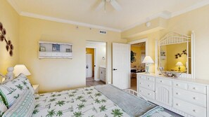 A bedroom with a bed, dresser, and a mirror. - Lorelei II 405 - Your perfect Ocean City getaway! (Ocean City)