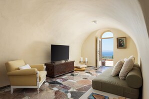 Signature Apartment, Patio, Sea View | Living area | 43-inch Smart TV with satellite channels
