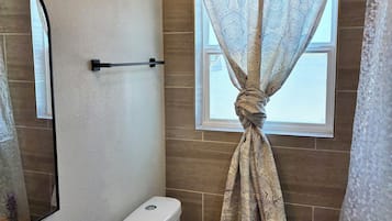 Bidet, towels, soap, toilet paper