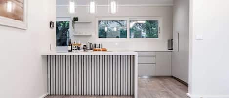 Coffee/tea maker, fridge, microwave, oven