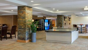 A hotel lobby with a ping pong table, seating area, and vending machines. - Experience the Ultimate Family Getaway at Sheraton Mountain Vista's 2-Bd Lockoff (Avon)