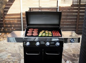 A barbecue grill with multiple cooking zones, a digital display, and a stainless steel finish. - Eden Luxury - 3 bedroom house in lovely Richardson, DFW Area (Richardson)