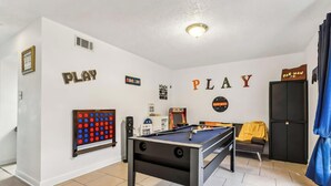 A room with a pool table, arcade games, and a door labeled 'PAC-MAN'. - Family Safe NOLA-Area : MSY Airport : GAME ROOM : FREE Park'n : 3 BEDS (Destrehan)