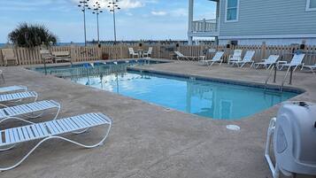 Seasonal outdoor pool, pool loungers