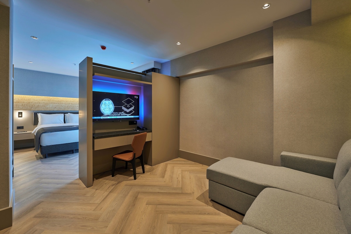 Suite junior, vistas a la ciudad | Colchones Select Comfort, minibar, caja fuerte