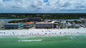 A coastal hotel with multiple buildings, a beachfront, and a view of the ocean. - Seagate 407 (Indian Shores)