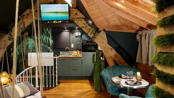 Suite Deluxe, hidromasaje | Área de sala de estar