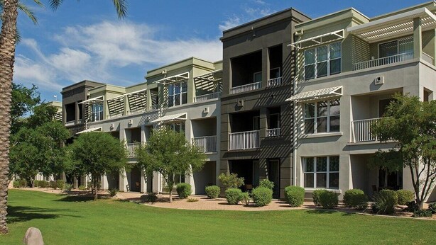 A multi-story building with balconies, a flat roof, and a well-maintained lawn. - 1 Bedroom Villa at Marriott Canyon Resort (Phoenix)