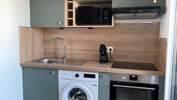 Coffee/tea maker, fridge, microwave, oven