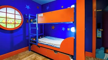A bunk bed with a window, star decorations, and a wooden floor.