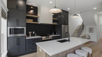 Coffee/tea maker, fridge, microwave, oven