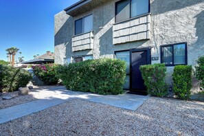 A two-story building with a stone facade, a black door, and a visible address number 479. - Old Town Scottsdale, Covered Parking, Pool, Sleeps 6 (Scottsdale)