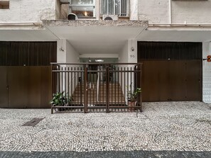 A gated entrance with a tiled pavement leading to a building entrance. - 5 min from Copacabana Beach | SF404 (Rio de Janeiro)