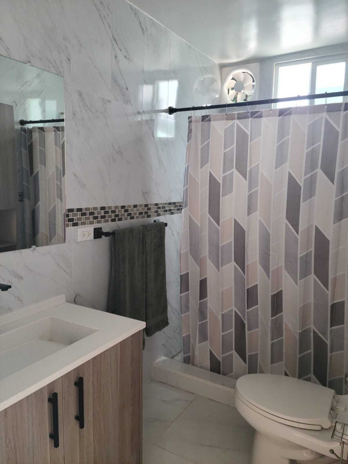 Shower, towels, soap, toilet paper