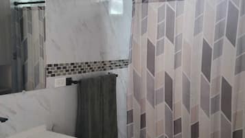 Shower, towels, soap, toilet paper