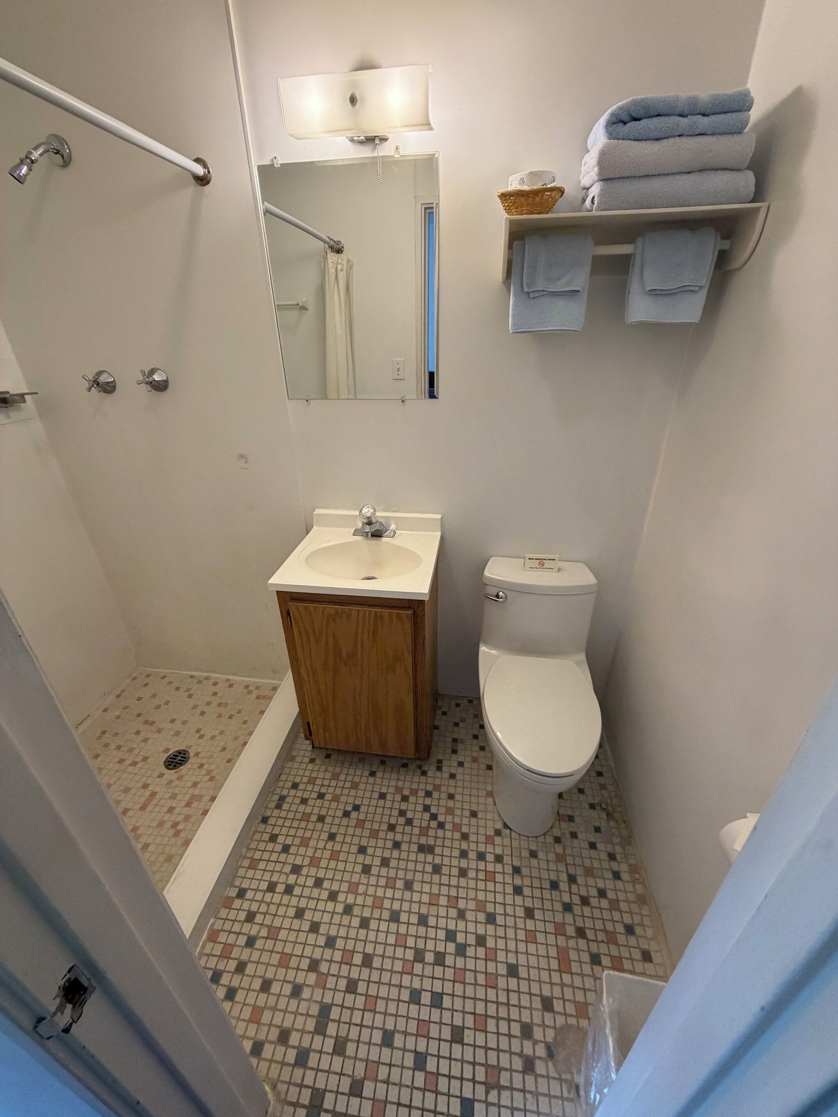 Shower, towels, soap, toilet paper