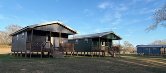 Cozy 1-bedroom cabin in serene Foxworth with AC. Sleeps 16