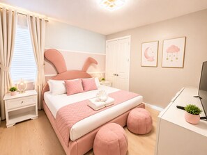 A bedroom with a bed, bedside tables, a desk, and a television. - 24BR Family Resort  Two Luxury Villas Near Disney (Kissimmee)