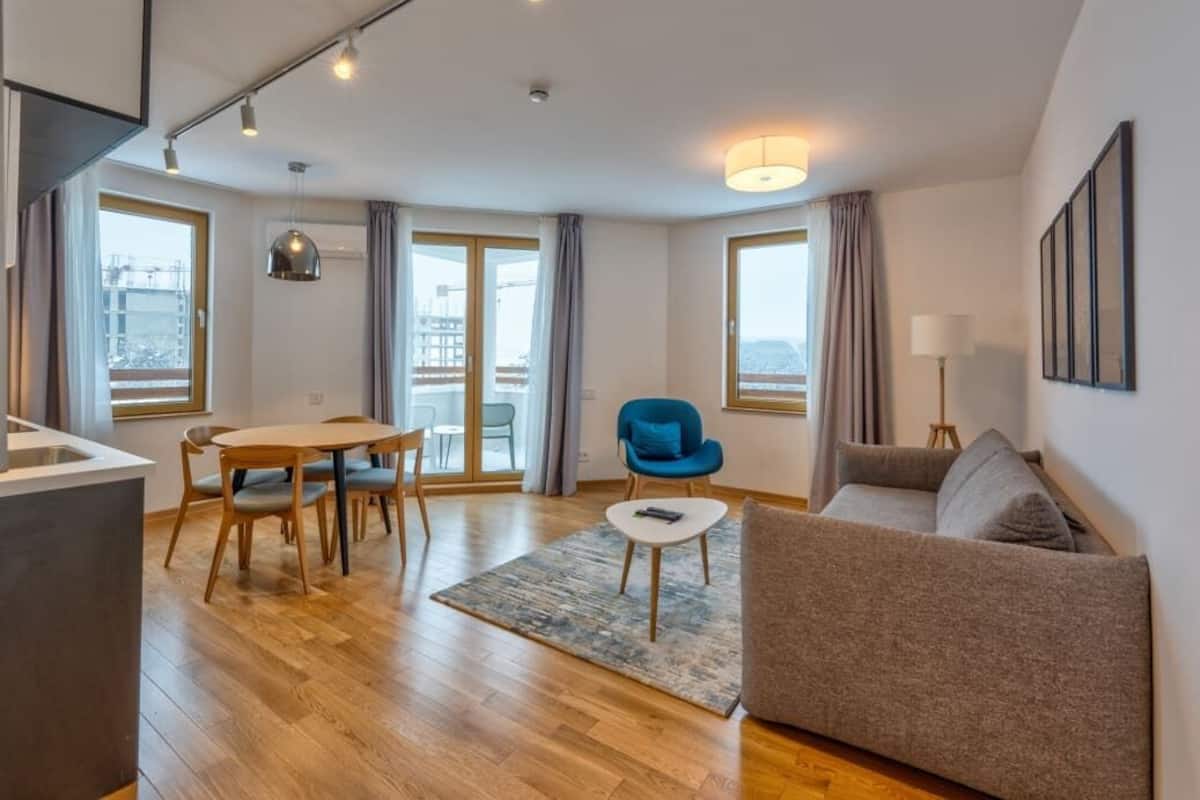 Superior Apartment | Living area | 49-inch Smart TV with digital channels, heated floors