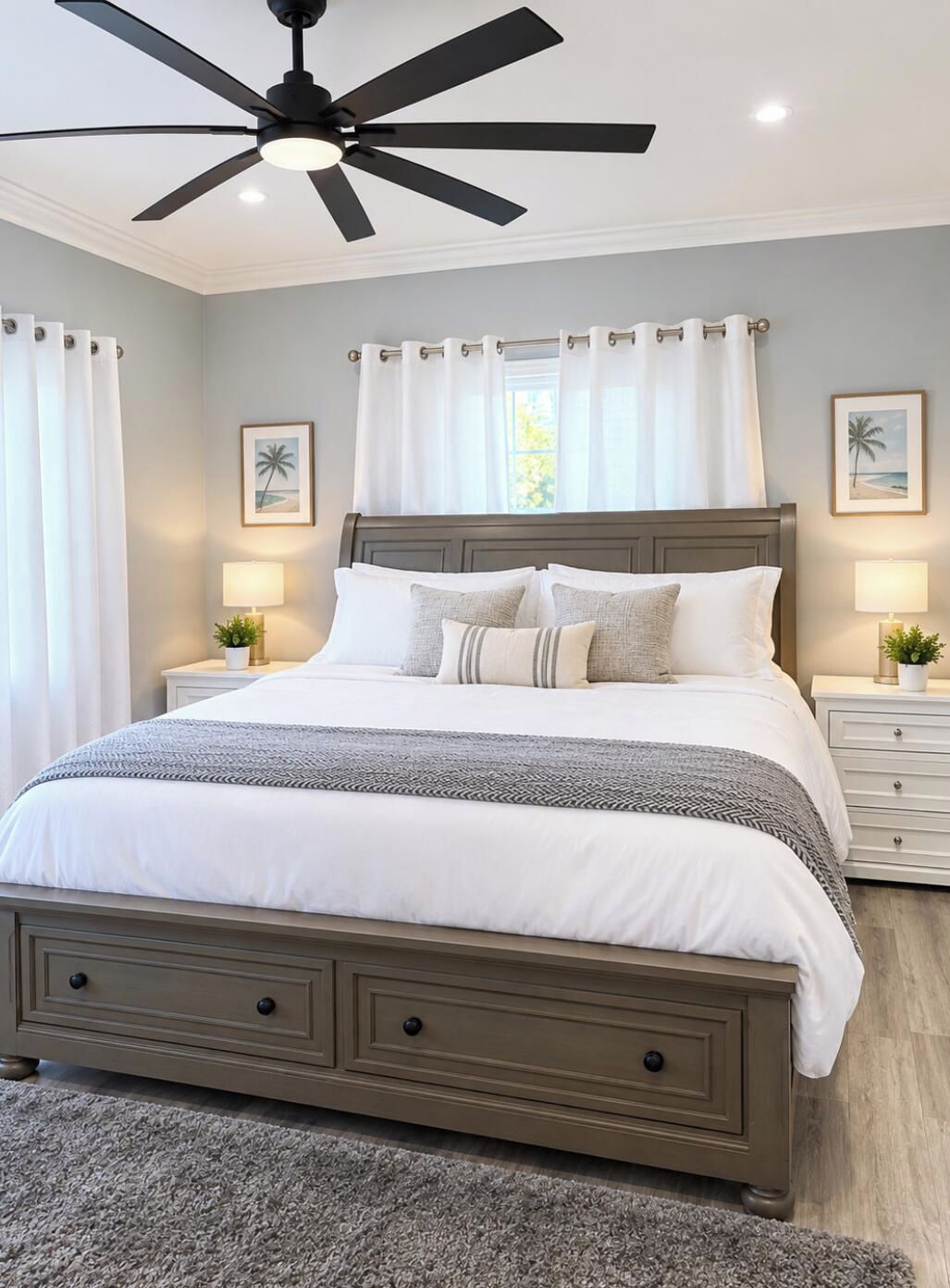 A bedroom with a bed, nightstands, a ceiling fan, and two wall-mounted lamps.