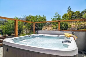 A hot tub with a wooden frame and a view of trees. - The Vintara - Glen Ellen,Hot Tub, New Construction (Glen Ellen)