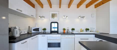 Coffee/tea maker, fridge, microwave, oven