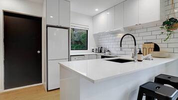 Coffee/tea maker, fridge, microwave, oven