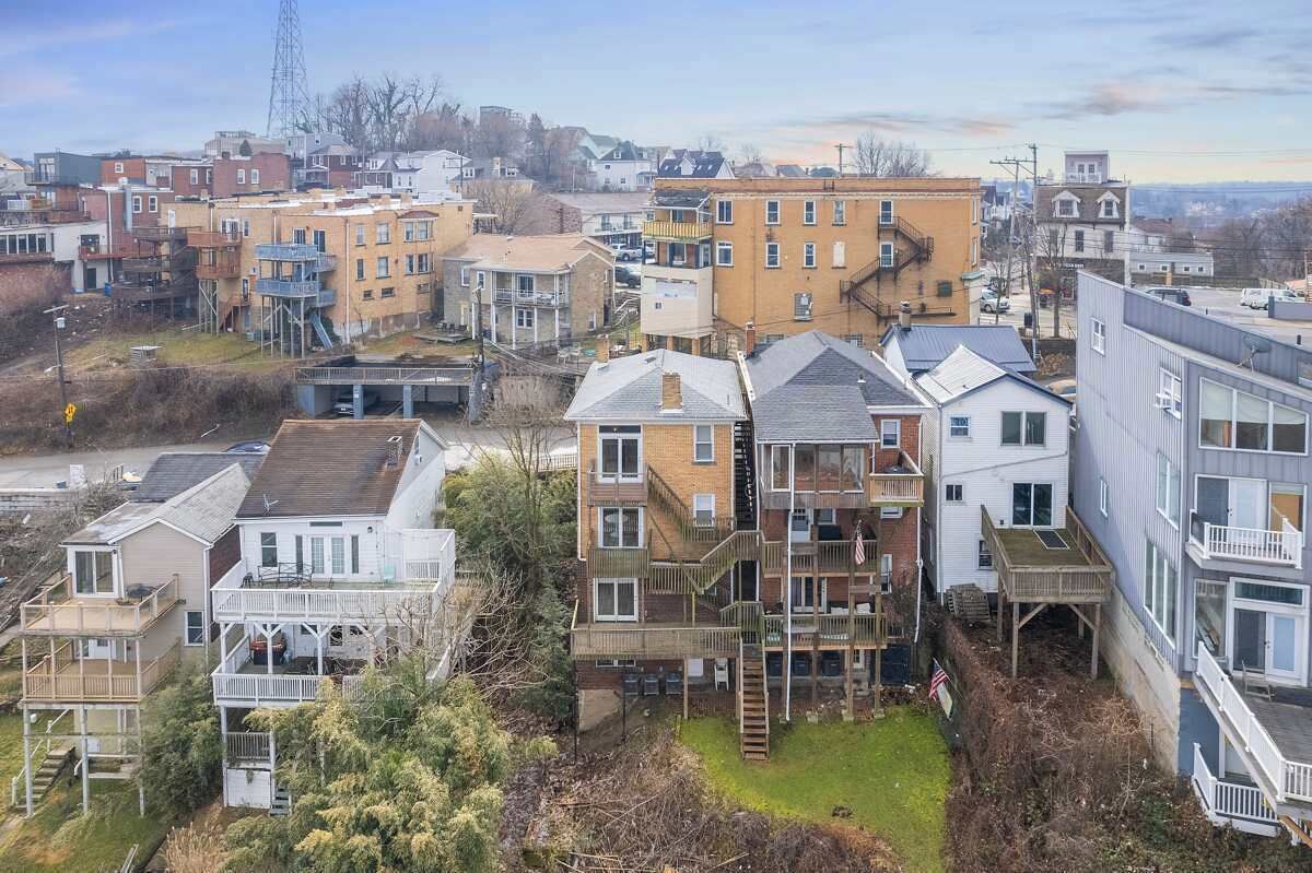 A residential area with multi-story buildings, some with balconies, and a mix of architectural styles.