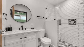 Shower, hair dryer, towels, shampoo