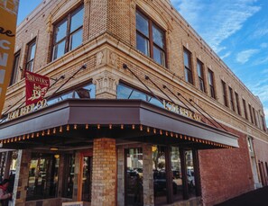 A brick building with a marquee sign for Lodi Beer Co. and a large windowed entrance. - Thoughtfully Designed Lodi Retreat - Fire Pit • Putting Green • Near Wineries (Lodi)