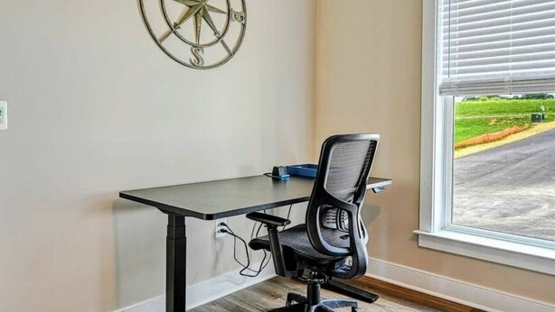 A room with a desk, chair, and a window with blinds. - Lakefront Escape | Private Pool + Dock Access (Mineral)