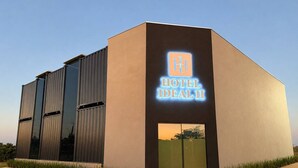 A modern hotel building with a prominent sign reading 'HOTEL IDEAL II'. - HOTEL IDEAL 2 (Inocencia)