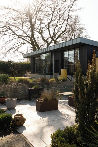 Modern architecture meets warm, eclectic comfort with a dash of Irish charm.