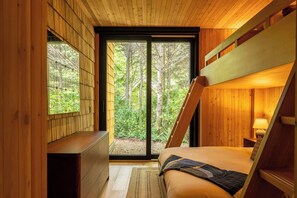 A king bed below with two twin beds above—ideal for a couple or a small family.