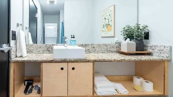 Shower, hair dryer, towels, shampoo